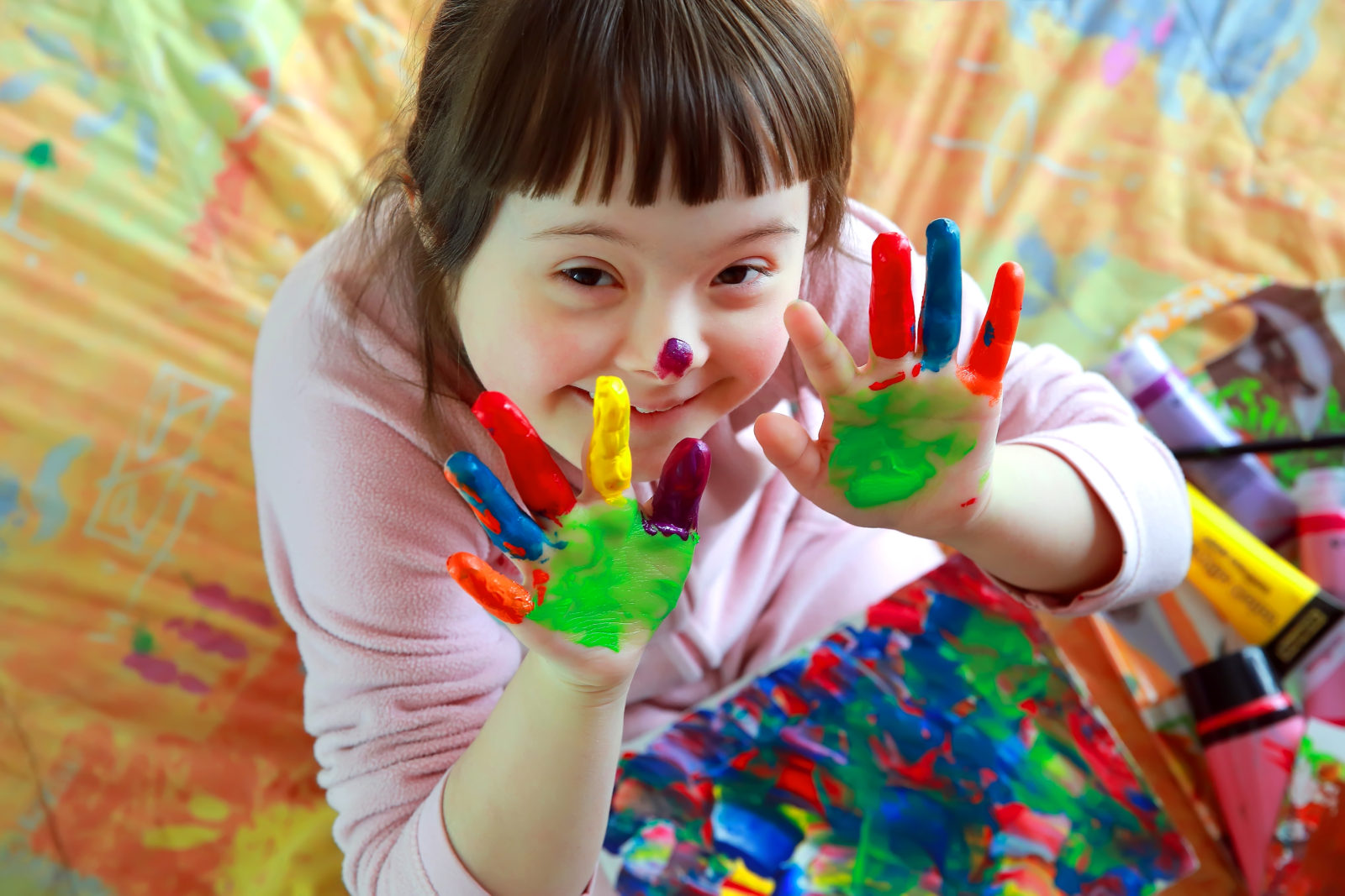 Cute little girl with painted hands Cute little girl with painted hands